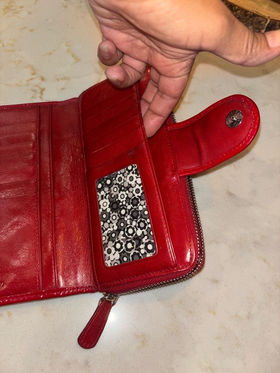 Brighton Red leather wallet featuring a decorative silver-toned snap closure. - Picture 9 of 16